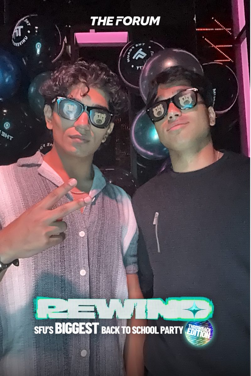 Two guests in novelty glasses at the photobooth at Rewind